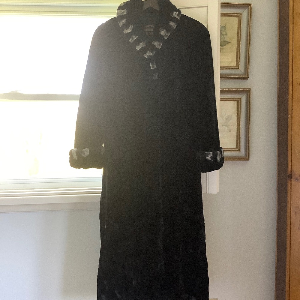 Full length black faux fur coat with white trim